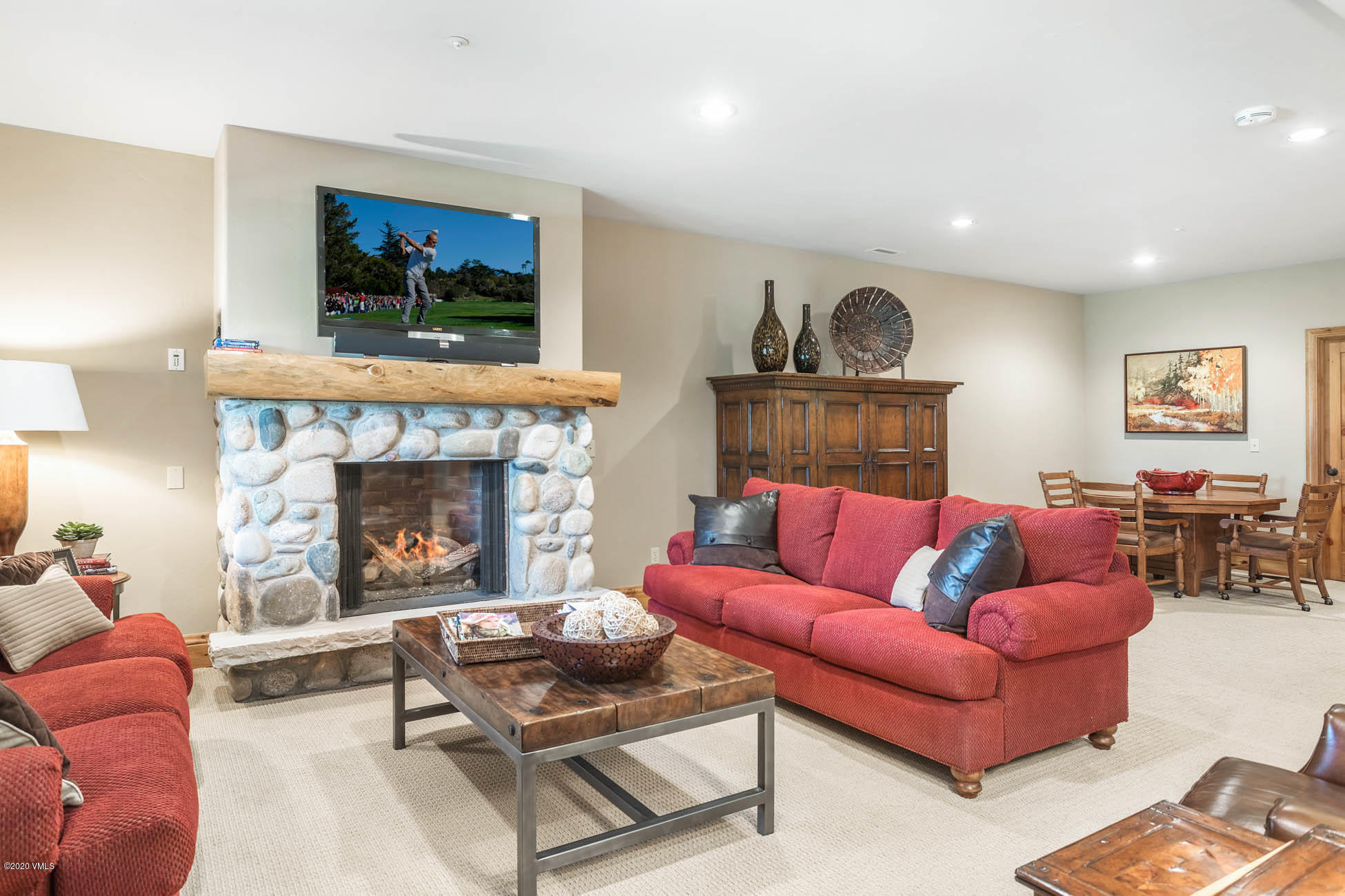 36 Fairway Lane Edwards, CO 81632 - Photo 32 of 37 a living room with furniture and a fireplace