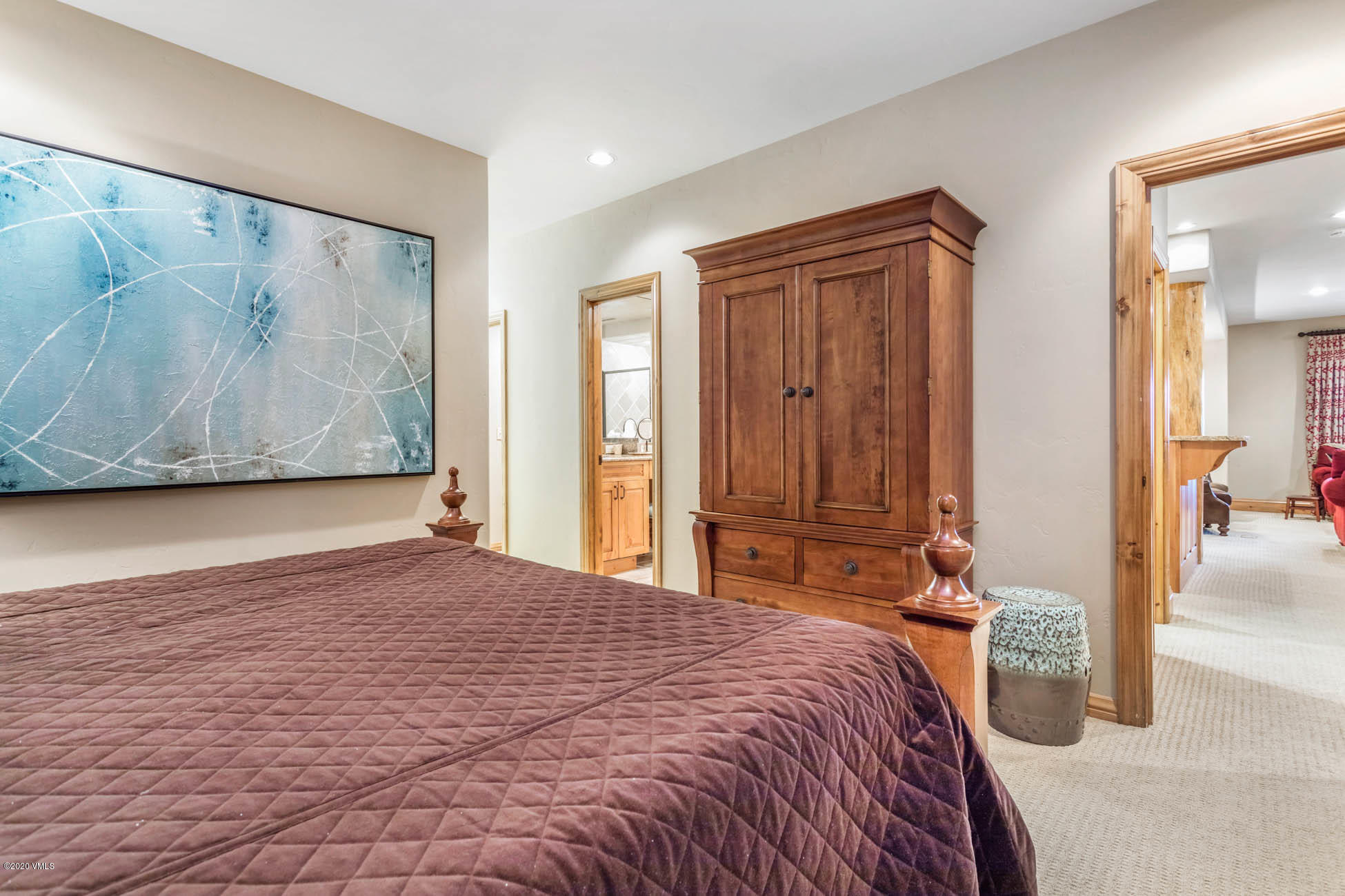 36 Fairway Lane Edwards, CO 81632 - Photo 36 of 37 a bedroom with a large bed and a painting on the wall