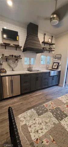 a view of kitchen with sink and wooden floor