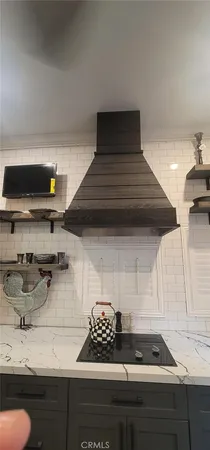 a kitchen with a stove and cabinets