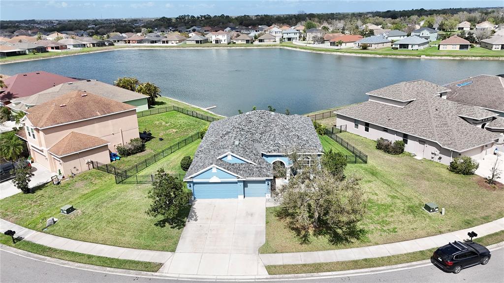 11326 78th Street East Parrish, FL 34219 - Photo 1 of 1 an aerial view of a house with a lake view