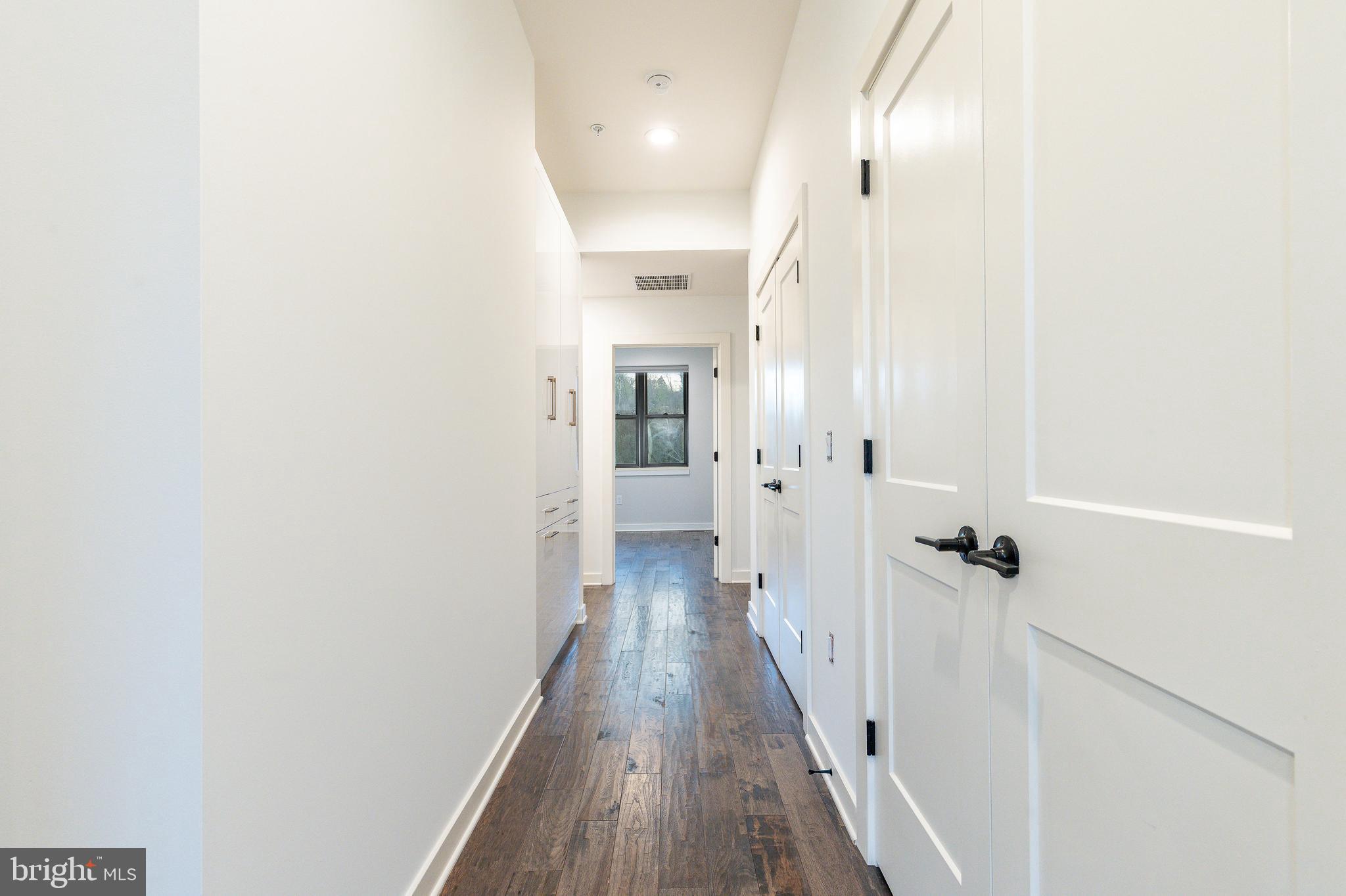 4523 Riverside Way Philadelphia, PA 19127 - Photo 31 of 50 a view of a hallway with wooden floor and staircase