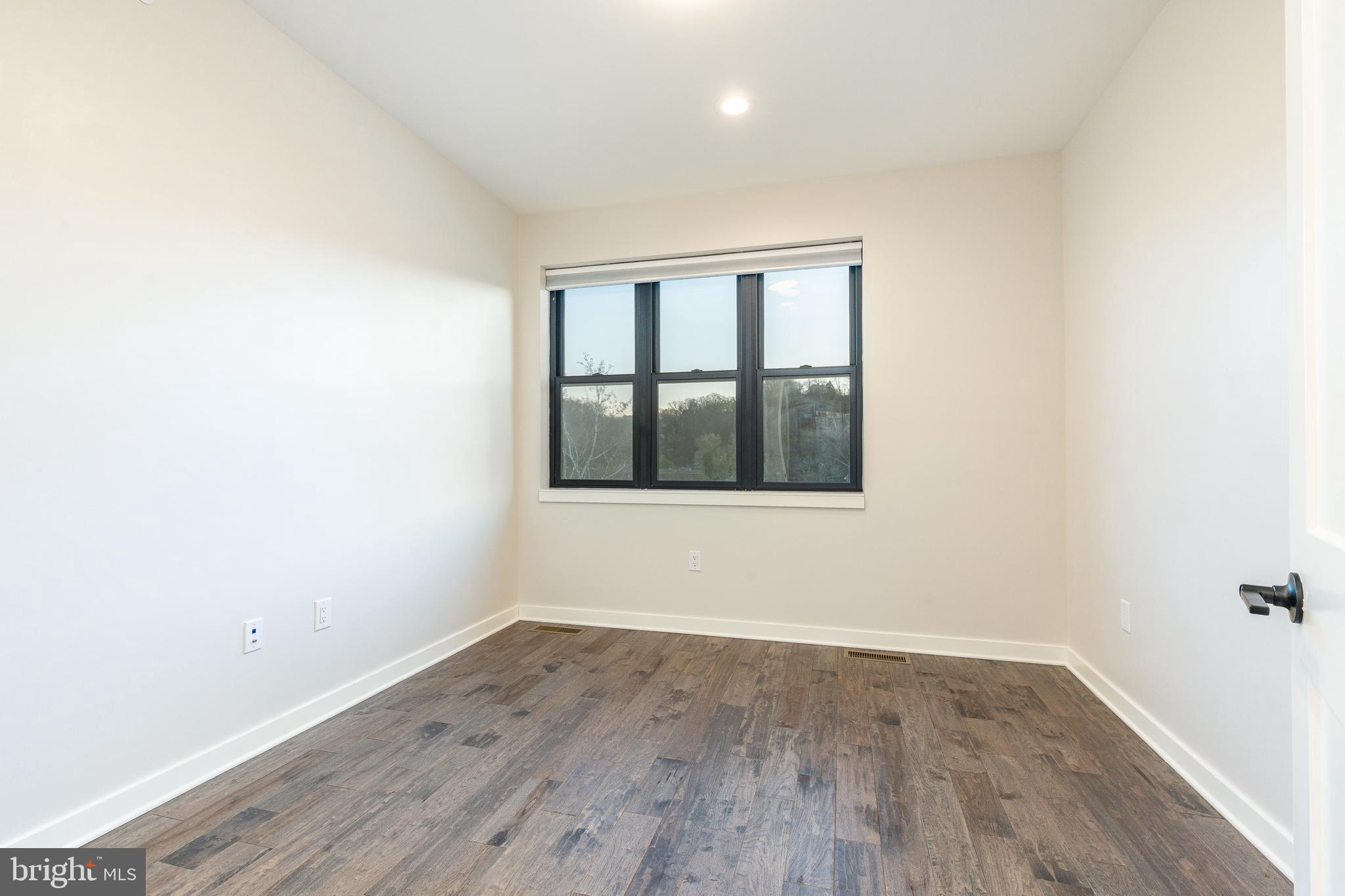 4523 Riverside Way Philadelphia, PA 19127 - Photo 32 of 50 a view of empty room with wooden floor and fan