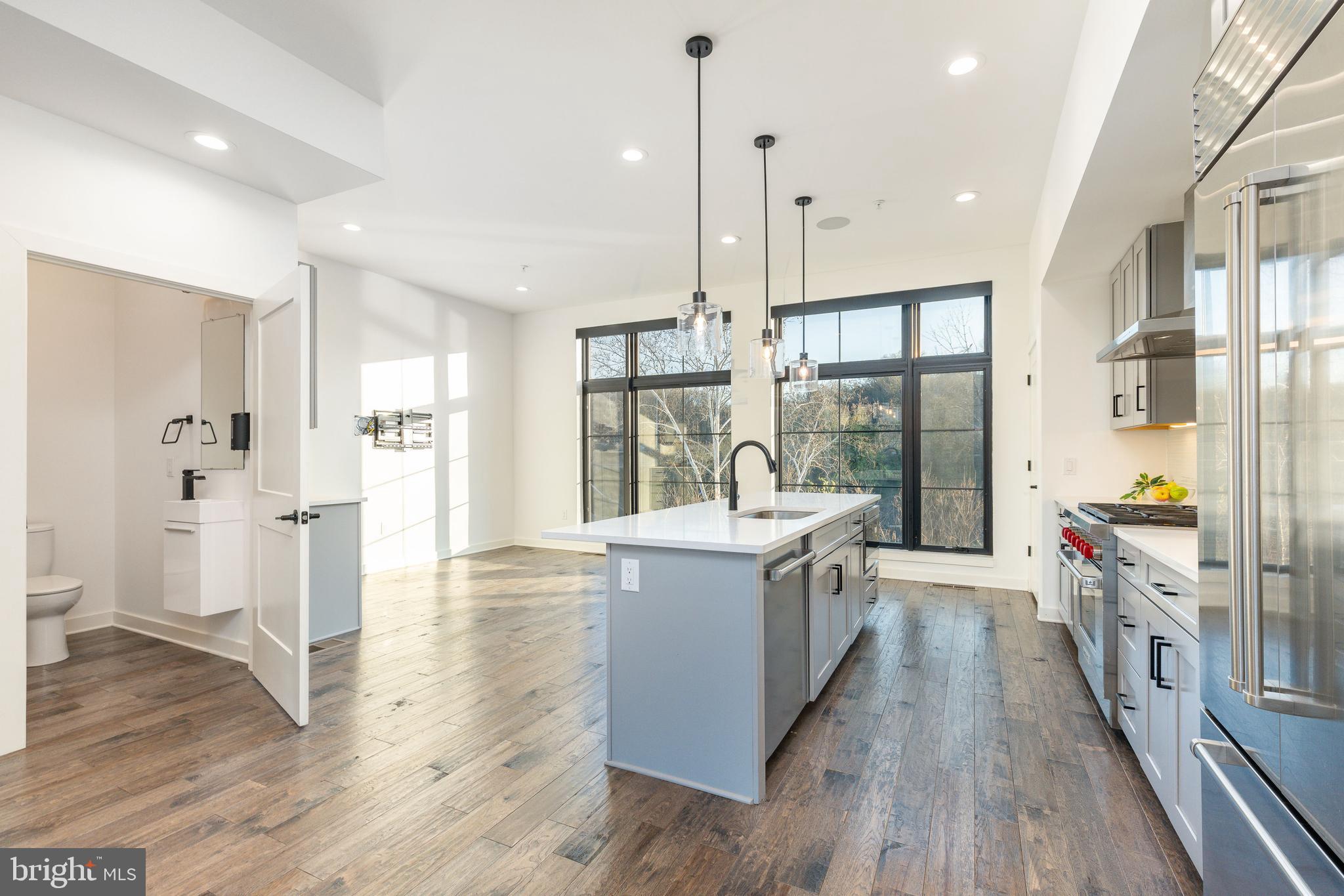 4523 Riverside Way Philadelphia, PA 19127 - Photo 7 of 50 a large kitchen with stainless steel appliances a lot of counter space and wooden floors