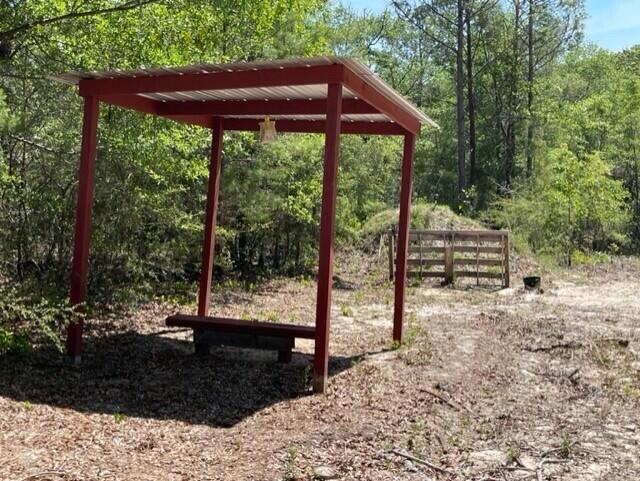 304 St James Road DeFuniak Springs, FL 32433 - Photo 21 of 37 a view of a patio with a yard