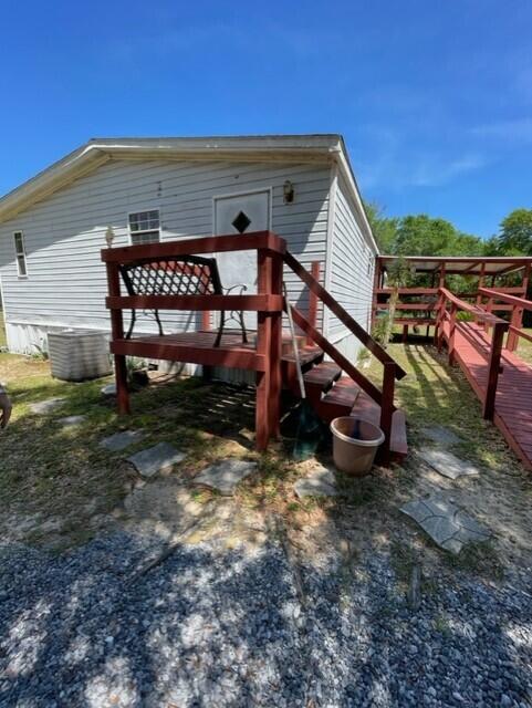 304 St James Road DeFuniak Springs, FL 32433 - Photo 29 of 37 a view of an house with backyard space and balcony