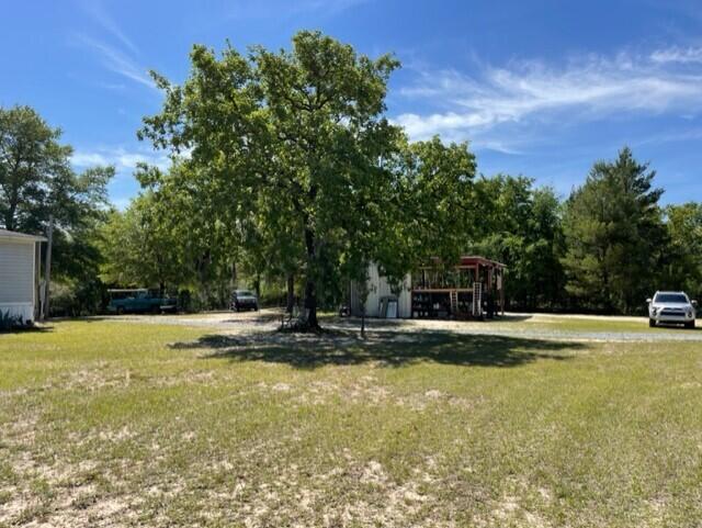 304 St James Road DeFuniak Springs, FL 32433 - Photo 9 of 37 a view of swimming pool and trees in the background