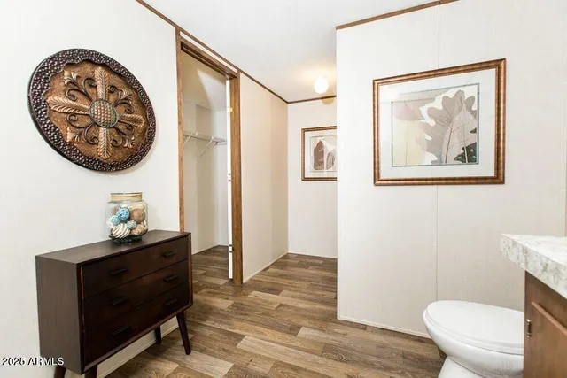 a bathroom with a toilet and a sink