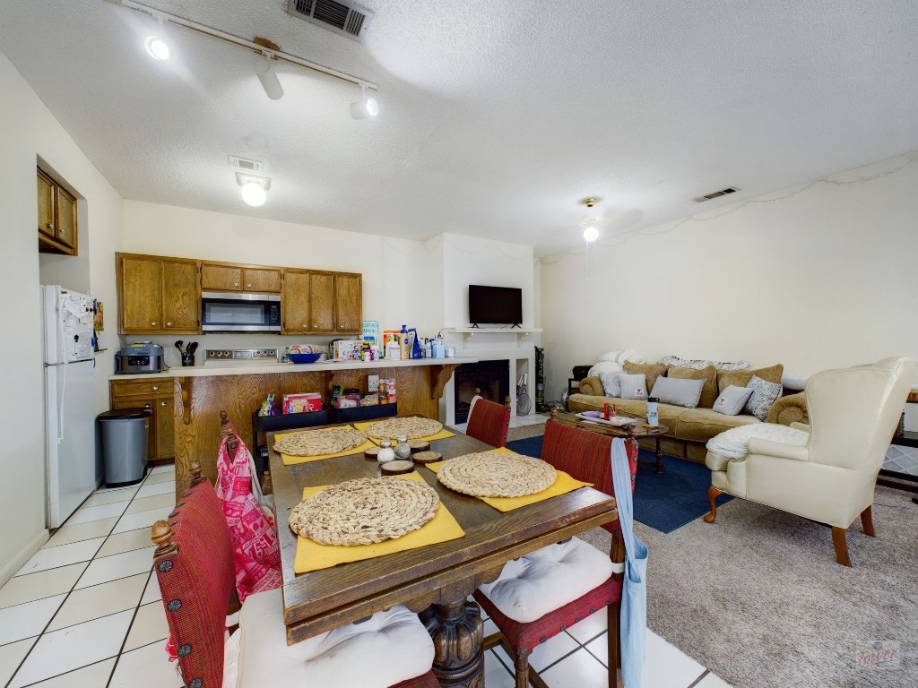 4111 Speedway, Unit 1 Austin, TX 78751 - Photo 3 of 14 a living room with furniture fireplace and flat screen tv