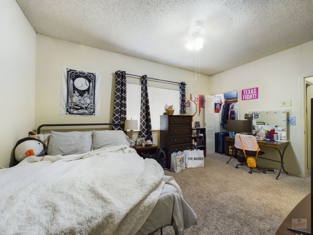 4111 Speedway, Unit 1 Austin, TX 78751 - Photo 10 of 14 a bedroom with a bed and furniture