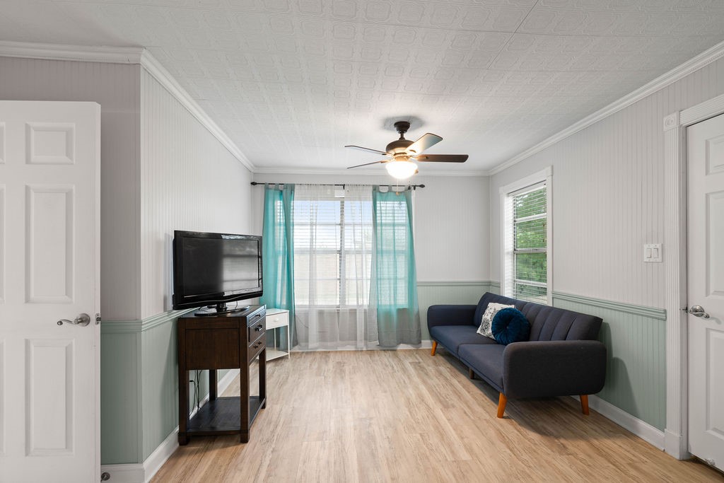 119 Century Drive Mathis, TX 78368 - Photo 15 of 38 a living room with furniture and a flat screen tv
