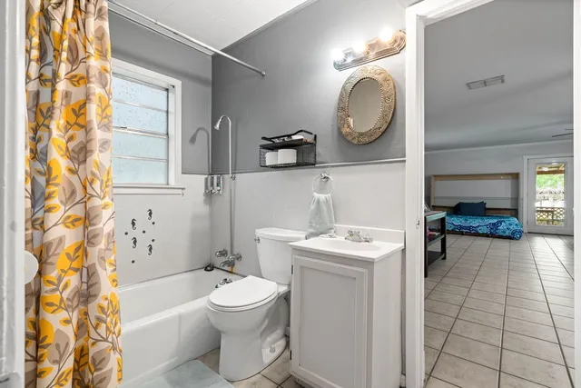 a bathroom with a tub and a sink