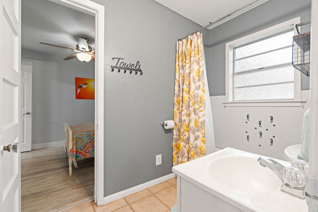 119 Century Drive Mathis, TX 78368 - Photo 18 of 38 a bathroom with a tub and a sink