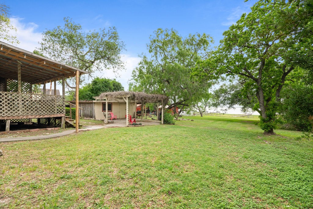 119 Century Drive Mathis, TX 78368 - Photo 20 of 38 a view of a house with backyard and sitting area