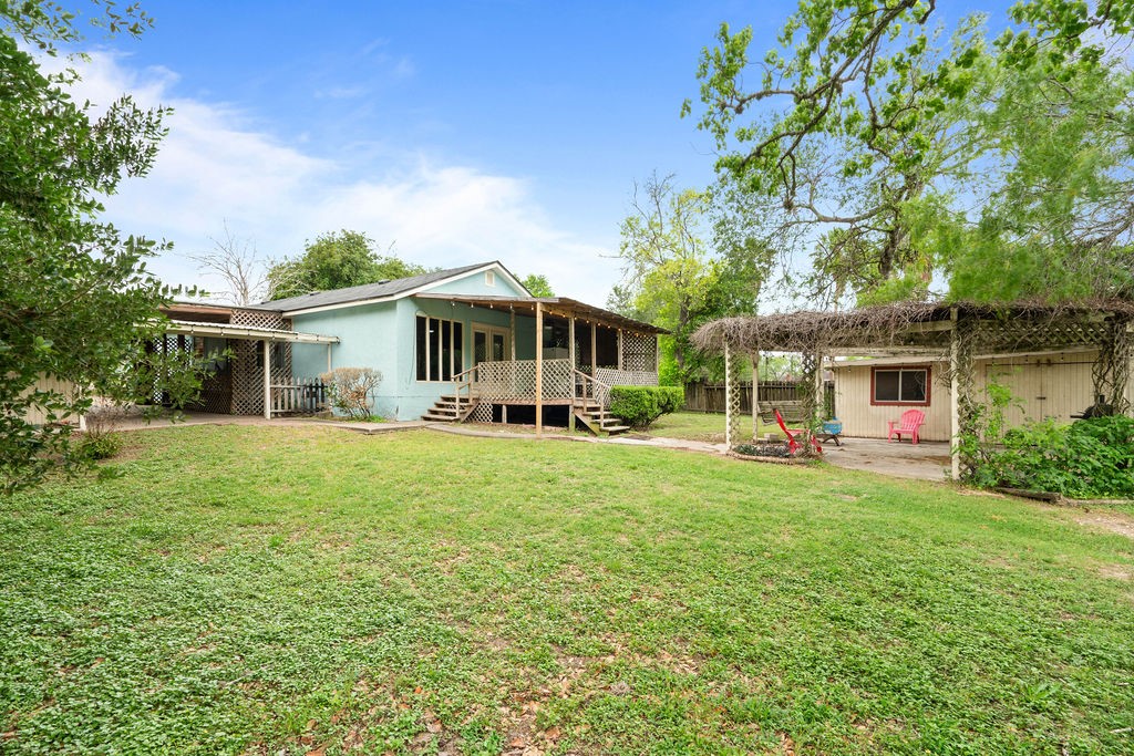 119 Century Drive Mathis, TX 78368 - Photo 22 of 38 a front view of a house with a garden and porch