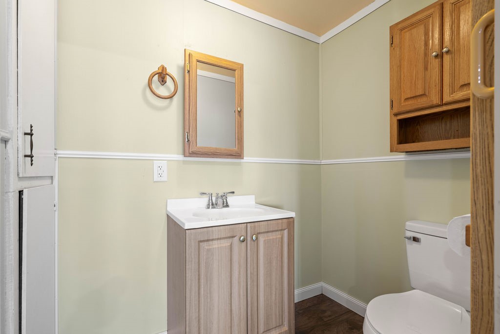 119 Century Drive Mathis, TX 78368 - Photo 25 of 38 a bathroom with a sink a toilet and mirror