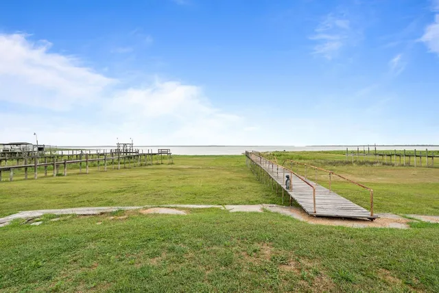 a view of a swimming pool with an outdoor space and seating area