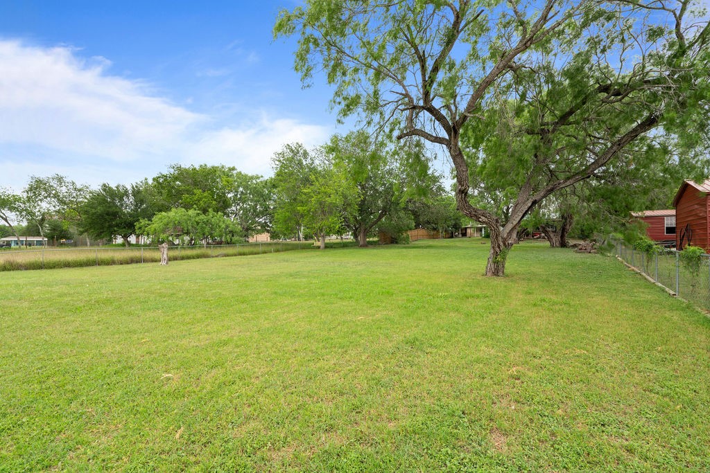 119 Century Drive Mathis, TX 78368 - Photo 34 of 38 a view of a field with trees in the background