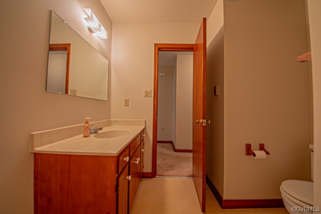 7212 Drexelbrook Road Chesterfield, VA 23832 - Photo 19 of 31 a bathroom with a sink a toilet and shower