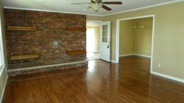 2248 Wolfe Road White Bluff, TN 37187 - Photo 2 of 9 Large living room with brick hearth