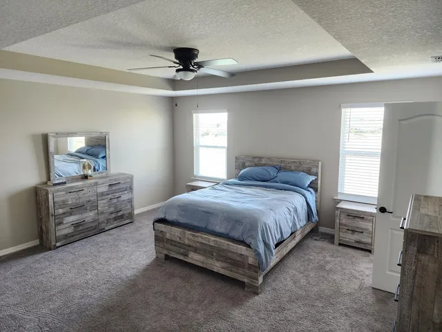 a bedroom with a bed and a couch