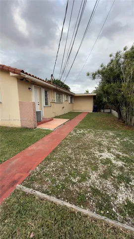 a house with yard in front of it