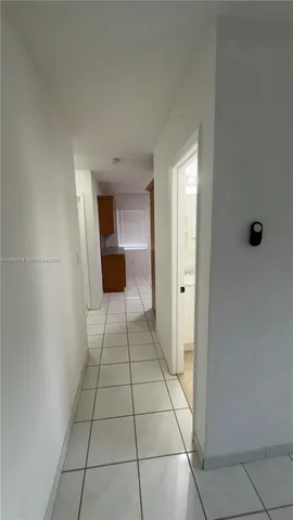 a view of an empty room and a window