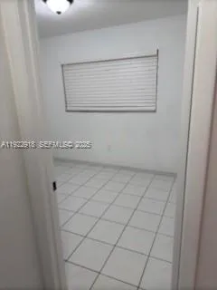 a white toilet sitting next to a shower