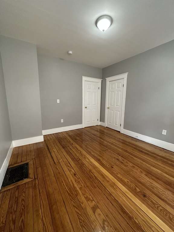35 Harvard Street, Unit 2 Boston, MA 02124 - Photo 19 of 22 a view of room with wooden floor