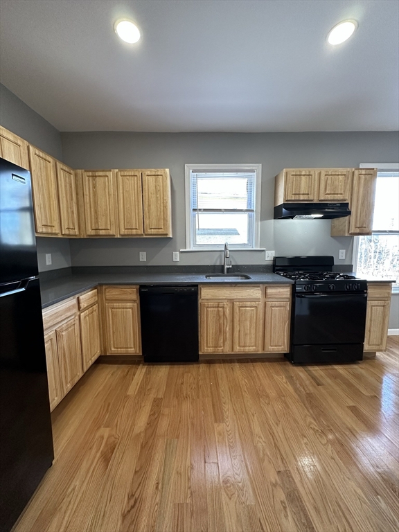 35 Harvard Street, Unit 2 Boston, MA 02124 - Photo 2 of 22 a kitchen with a sink and a stove top oven