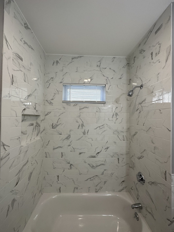 35 Harvard Street, Unit 2 Boston, MA 02124 - Photo 7 of 22 a bathroom with a bathtub