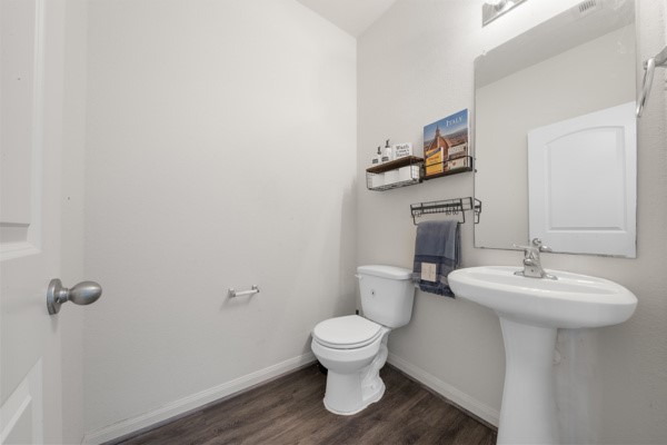 1327 Diamond Drape Drive Rosharon, TX 77583 - Photo 13 of 26 a bathroom with a toilet a sink and mirror