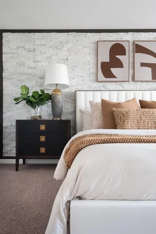 a spacious bedroom with a bed and furniture