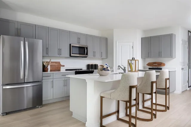 a kitchen with appliances cabinets and a sink