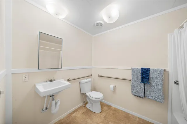 a bedroom with a bed and a cabinet