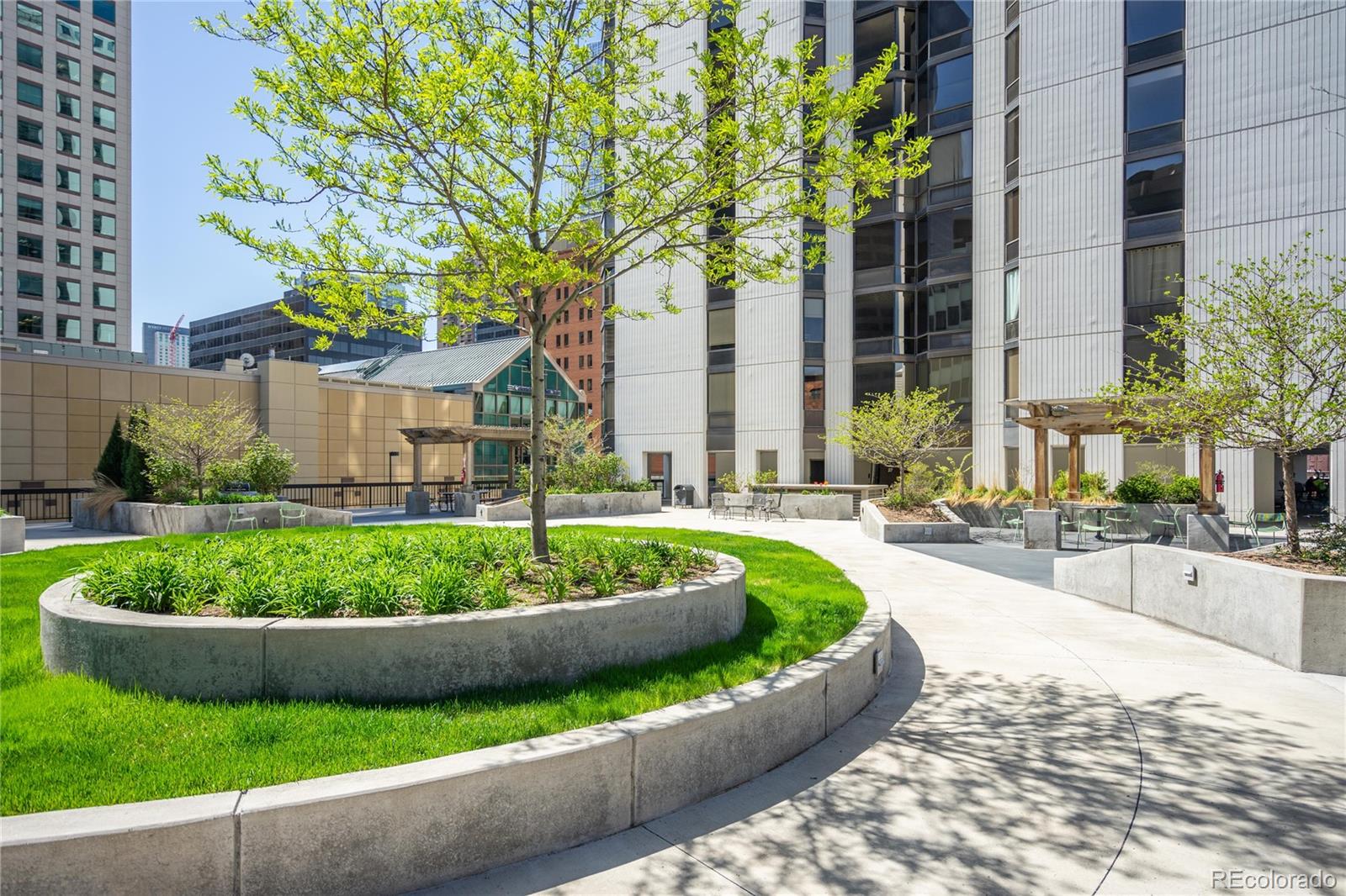 1625 Larimer Street, Unit 905 Denver, CO 80202 - Photo 8 of 12 a view of a backyard with plants and patio