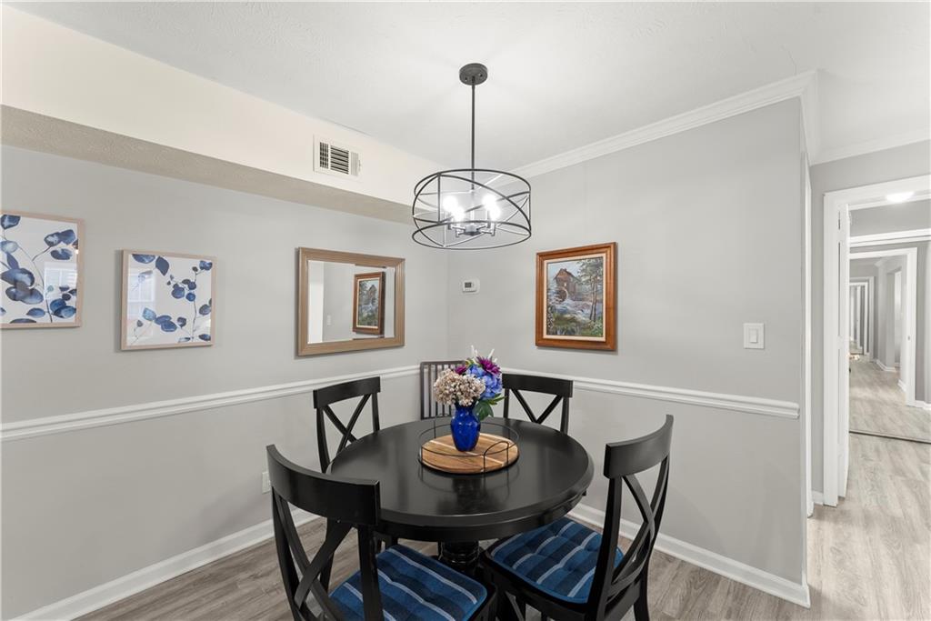 1997 Brian Way Decatur, GA 30033 - Photo 11 of 27 a view of a dining room with furniture wooden floor and a chandelier