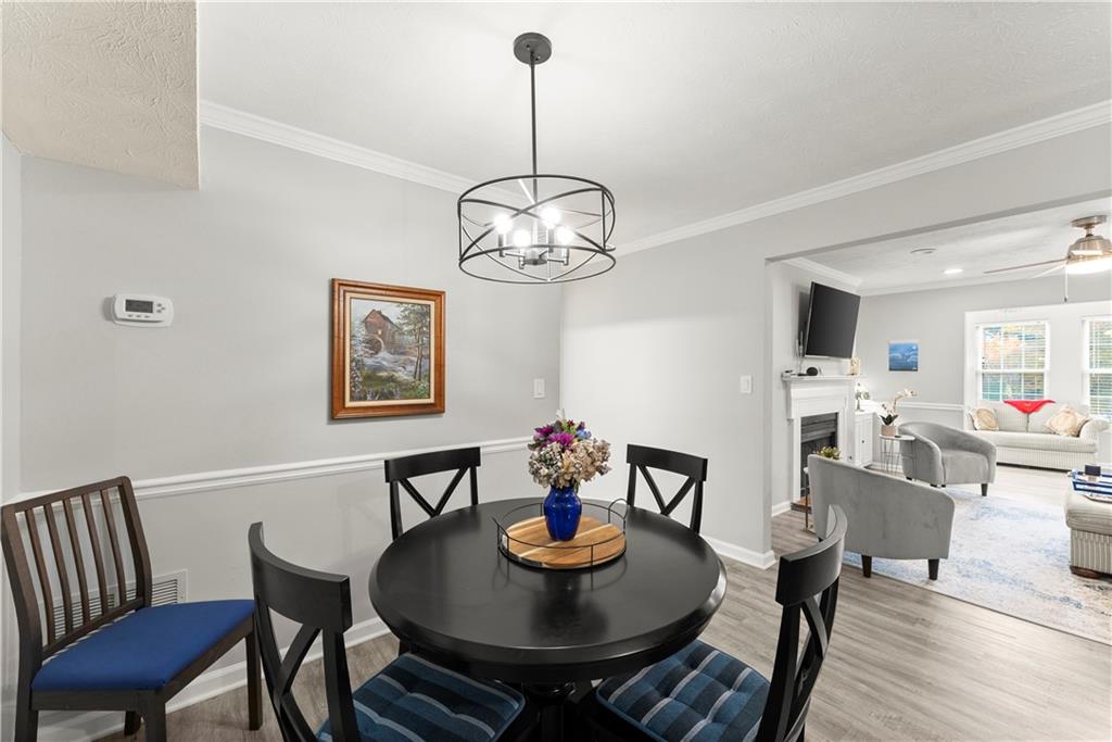 1997 Brian Way Decatur, GA 30033 - Photo 12 of 27 a view of a dining room with furniture a chandelier and wooden floor