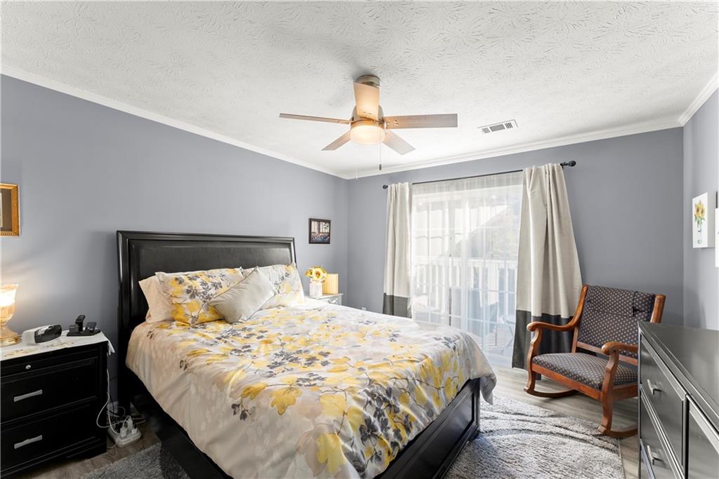 1997 Brian Way Decatur, GA 30033 - Photo 14 of 27 a bedroom with a bed and a chandelier