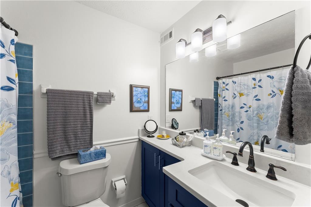 1997 Brian Way Decatur, GA 30033 - Photo 20 of 27 a bathroom with a toilet sink and mirror