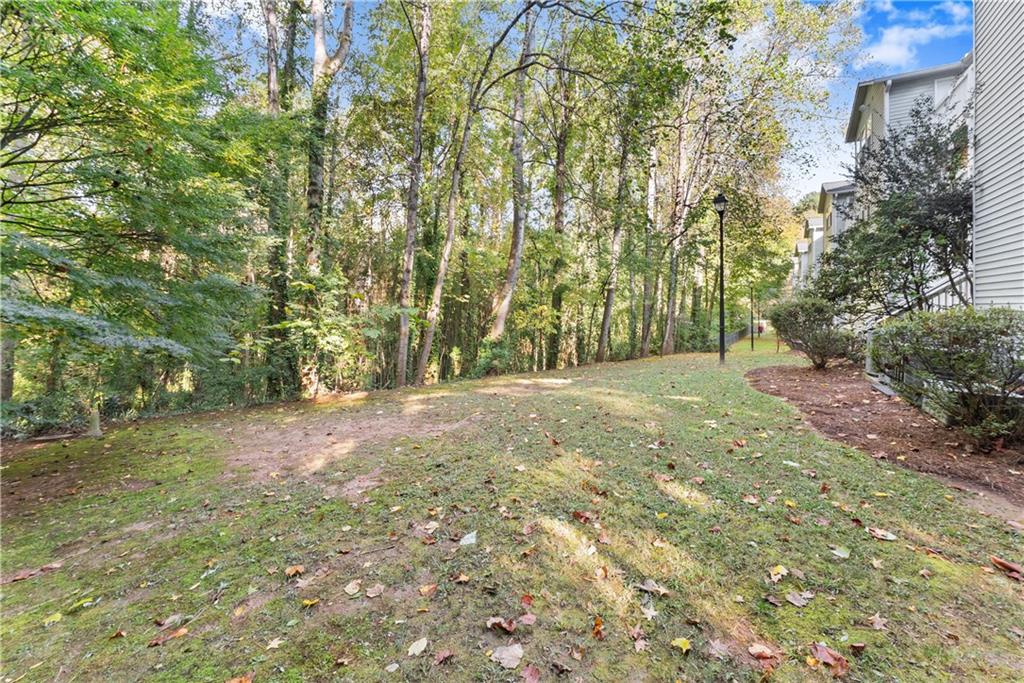 1997 Brian Way Decatur, GA 30033 - Photo 24 of 27 a view of a yard with large trees