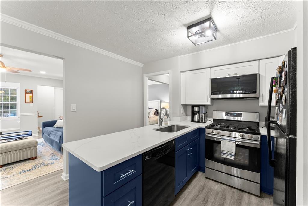 1997 Brian Way Decatur, GA 30033 - Photo 9 of 27 a kitchen with a stove a sink and a refrigerator