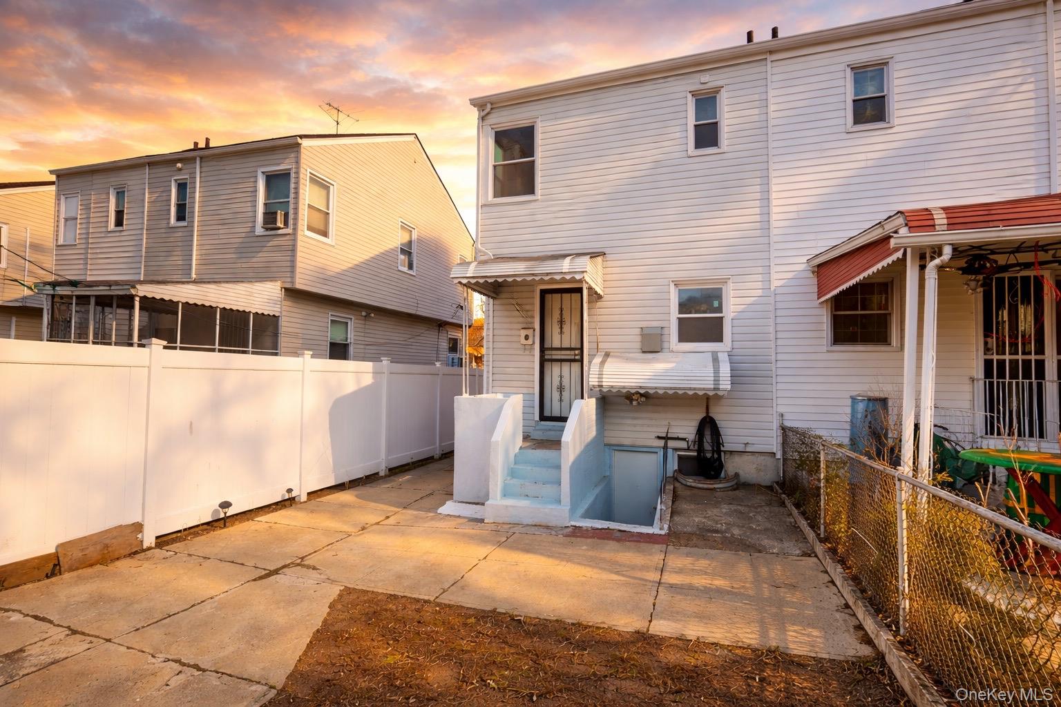 219-42 141st Road Queens, NY 11413 - Photo 10 of 23 a view of a house with backyard and sitting area