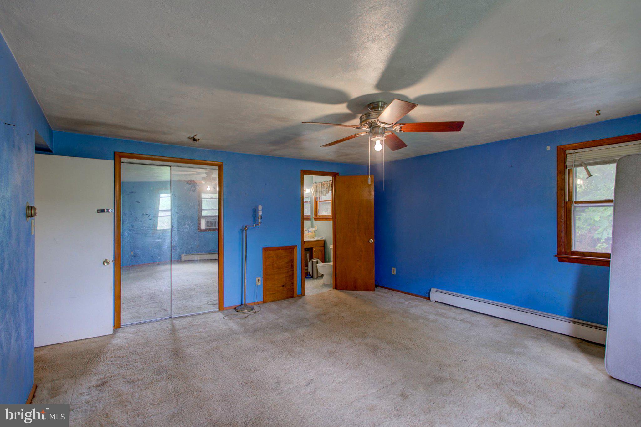 1406 Richmond Road Red Lion, PA 17356 - Photo 15 of 41 Spacious room with vibrant blue walls.