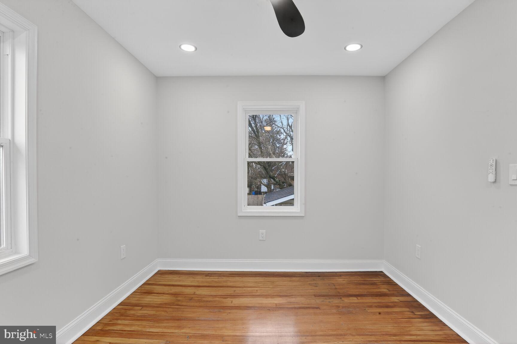 4013 4th Street Baltimore, MD 21225 - Photo 13 of 35 a view of a livingroom with wooden floor and window