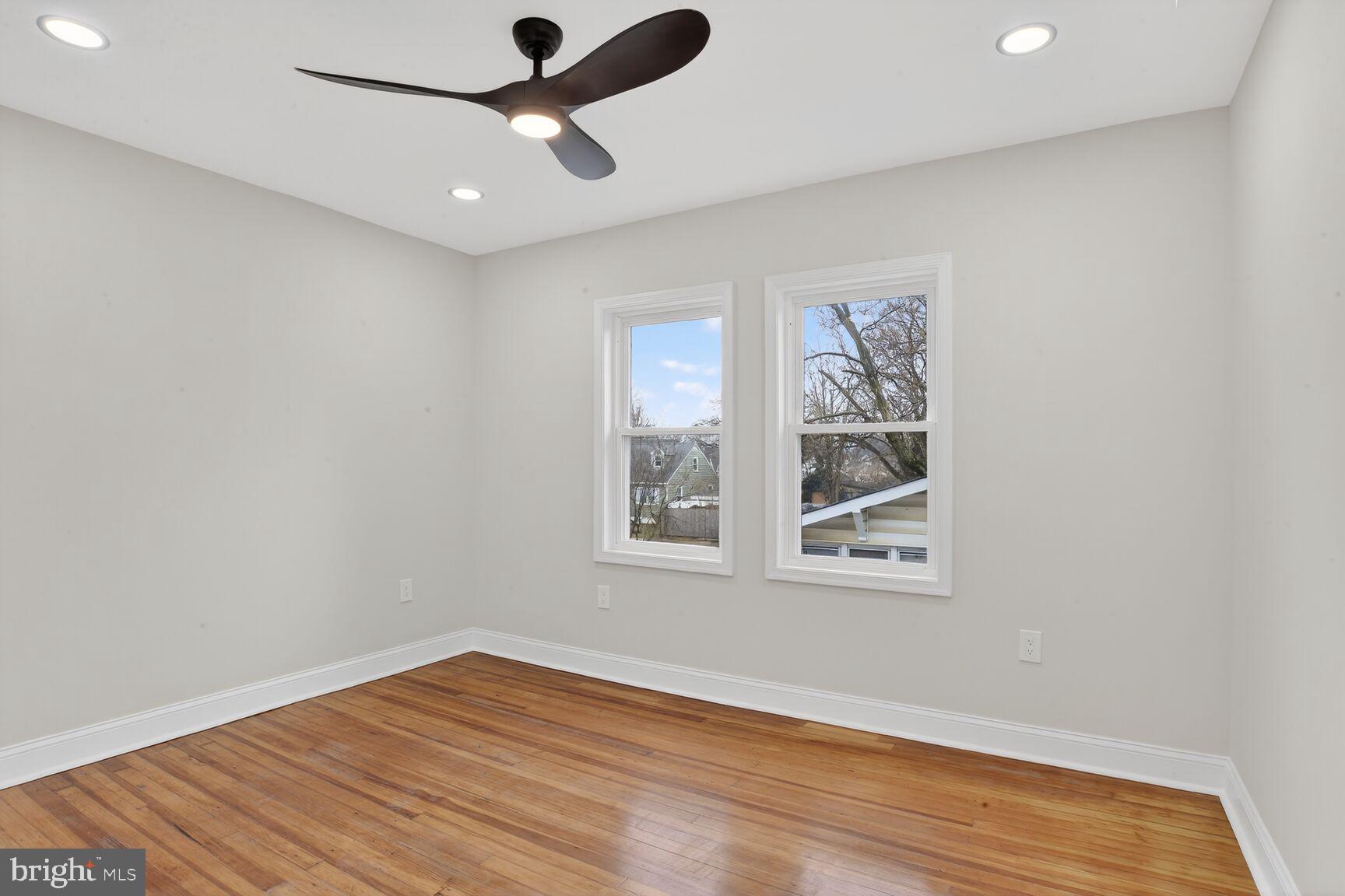 4013 4th Street Baltimore, MD 21225 - Photo 14 of 35 a view of empty room with wooden floor and fan