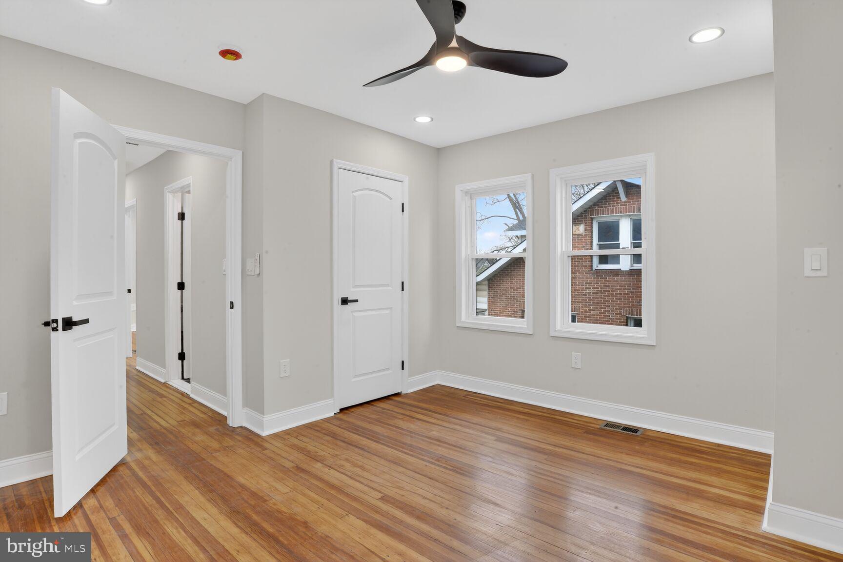 4013 4th Street Baltimore, MD 21225 - Photo 17 of 35 wooden floor in an empty room with a window