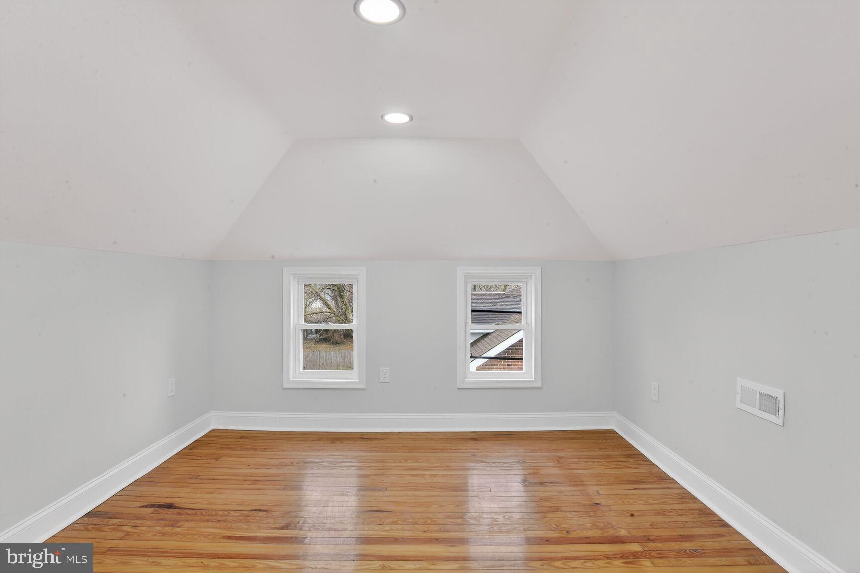 4013 4th Street Baltimore, MD 21225 - Photo 19 of 35 a view of empty room with wooden floor and fan