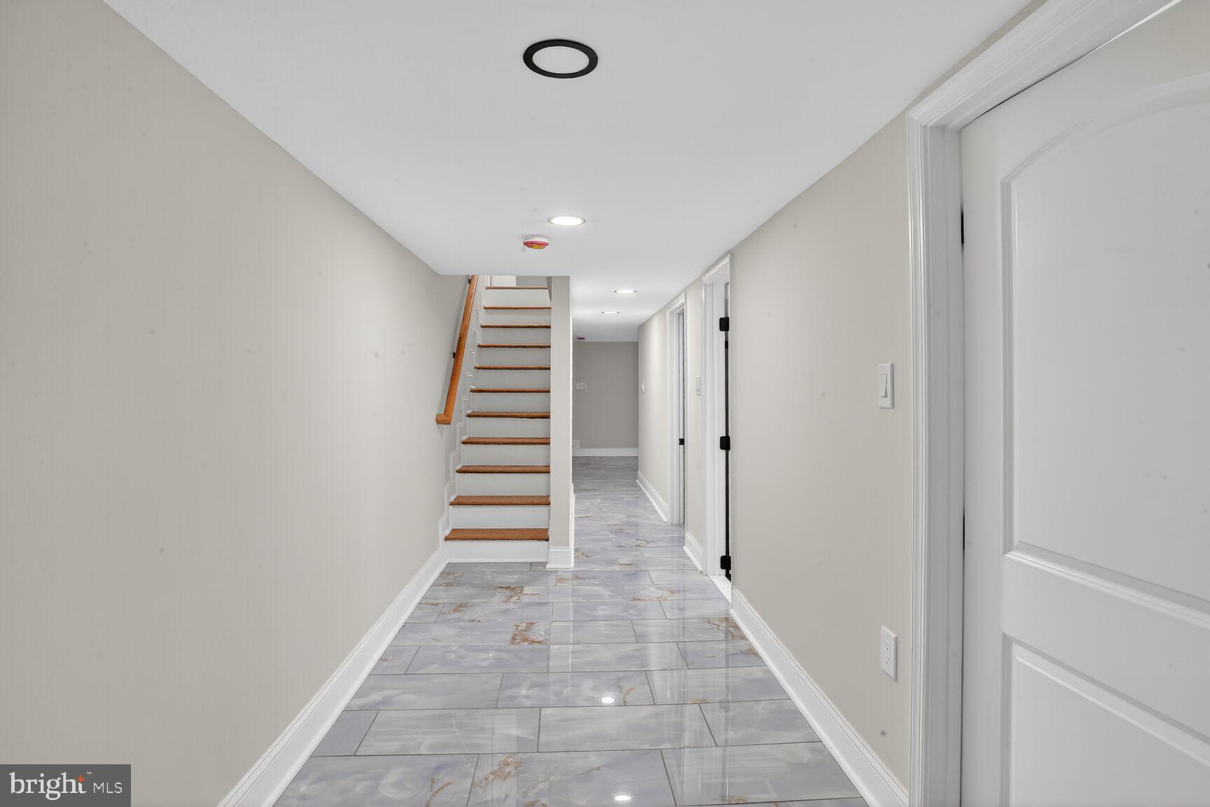 4013 4th Street Baltimore, MD 21225 - Photo 22 of 35 a view of entryway with stairs and white walls