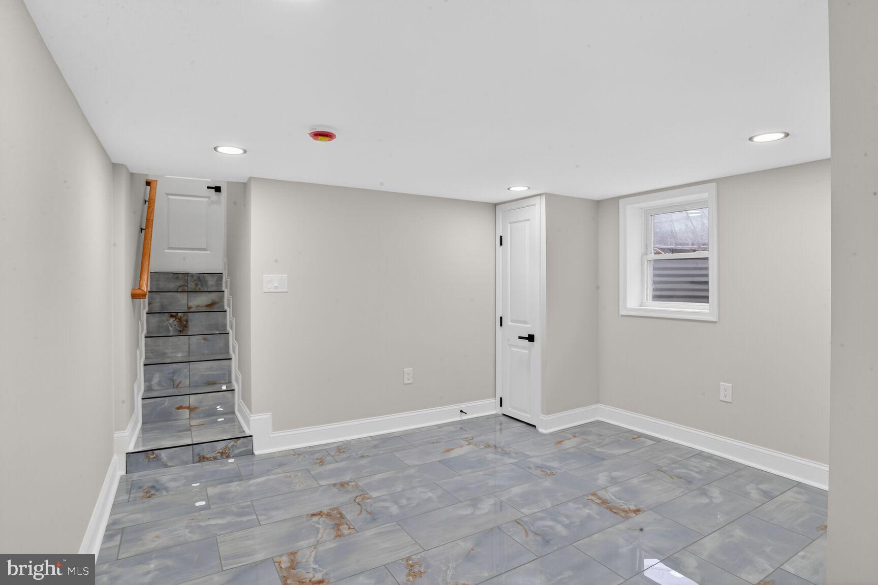 4013 4th Street Baltimore, MD 21225 - Photo 27 of 35 a view of an empty room with a fireplace